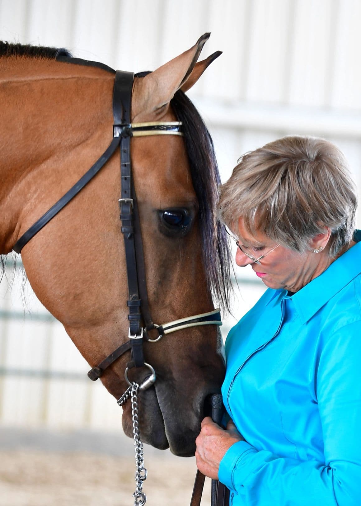 Woman sharing a close moment with her horse